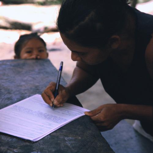 Woman filling out a registration form
